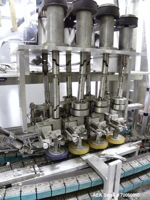 Used Resina Inline Quill Capper, 8 Quill, Model UN40-1250. Capable of speeds over 250 Bottles per minute. Has a cap size range from 13 - 70mm (with changeparts). Has a vertical pin style sorter for c...