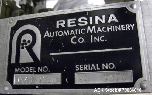 Used Resina Inline Quill Capper, 8 Quill, Model UN40-1250. Capable of speeds over 250 Bottles per minute. Has a cap size range from 13 - 70mm (with changeparts). Has a vertical pin style sorter for c...