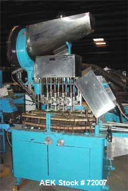 Usedina model U-40 automatic screw capper, 4 quill straight conveyorized dual gripper. Approximate cap range: 13 to 38mm or 43 to 70mm. Approximate speed range: 60-150 per minute. Container range: 1/...