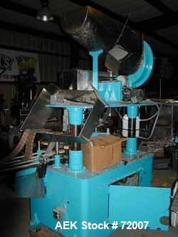 Usedina model U-40 automatic screw capper, 4 quill straight conveyorized dual gripper. Approximate cap range: 13 to 38mm or 43 to 70mm. Approximate speed range: 60-150 per minute. Container range: 1/...
