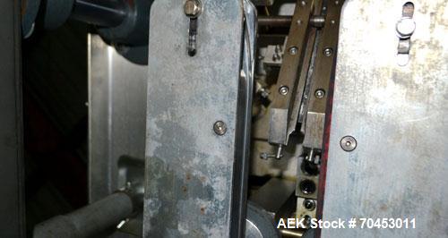 Used Sure Kap SK6000 Quill capper. Three spindle capper with adjustable chute will handle caps from 13 to 110MM w/o changeparts. Has dual gripper belts, C frame construction will mount up to any conv...