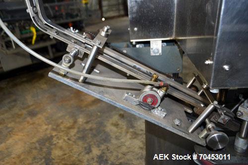 Used Sure Kap SK6000 Quill capper. Three spindle capper with adjustable chute will handle caps from 13 to 110MM w/o changeparts. Has dual gripper belts, C frame construction will mount up to any conv...