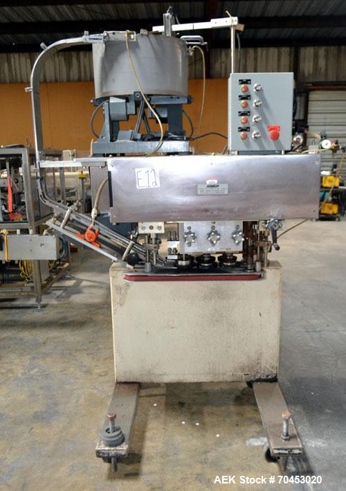 Used Sure Kap SK6000-18 Quill capper. Three spindle capper with adjustable chute will handle caps from 13 to 110MM w/o changeparts. Has dual gripper belts, C frame construction will mount up to any c...