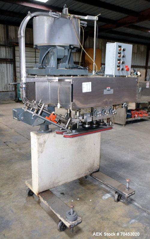 Used Sure Kap SK6000-18 Quill capper. Three spindle capper with adjustable chute will handle caps from 13 to 110MM w/o changeparts. Has dual gripper belts, C frame construction will mount up to any c...