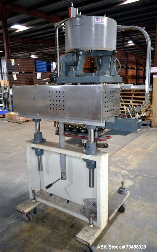 Used Sure Kap SK6000-18 Quill capper. Three spindle capper with adjustable chute will handle caps from 13 to 110MM w/o changeparts. Has dual gripper belts, C frame construction will mount up to any c...