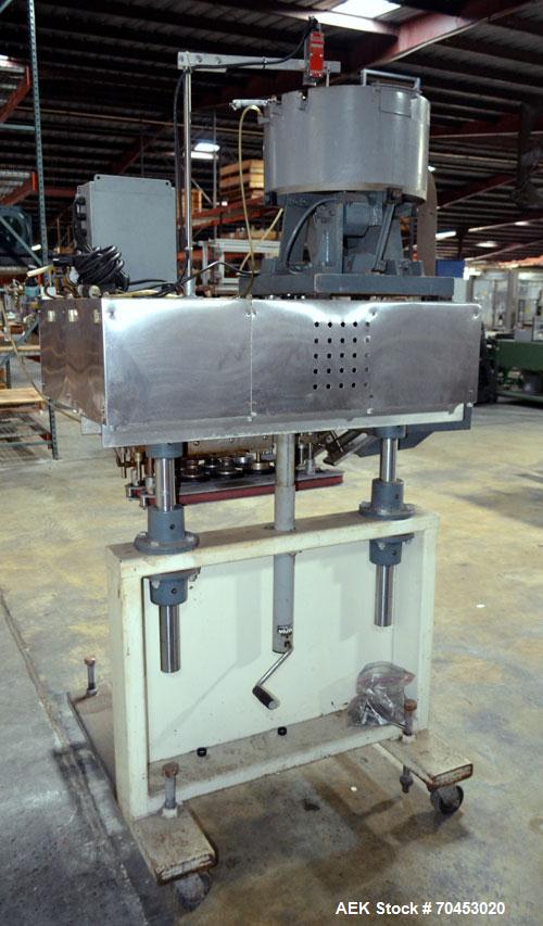 Used Sure Kap SK6000-18 Quill capper. Three spindle capper with adjustable chute will handle caps from 13 to 110MM w/o changeparts. Has dual gripper belts, C frame construction will mount up to any c...