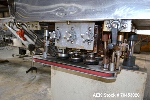 Used Sure Kap SK6000-18 Quill capper. Three spindle capper with adjustable chute will handle caps from 13 to 110MM w/o changeparts. Has dual gripper belts, C frame construction will mount up to any c...