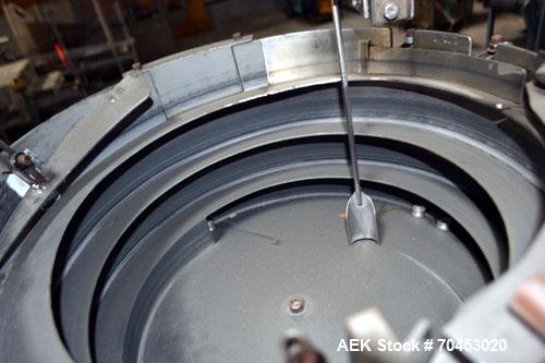 Used Sure Kap SK6000-18 Quill capper. Three spindle capper with adjustable chute will handle caps from 13 to 110MM w/o changeparts. Has dual gripper belts, C frame construction will mount up to any c...