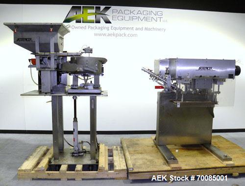 Used SureKap Fully Automatic Straight Line Six Spindle Quill Capper, Model SK6000-SP. Capacities 100 bottles per minute depending on size and conveyor speed. Cap Size Range: diameter 8mm to 110mm (Ma...