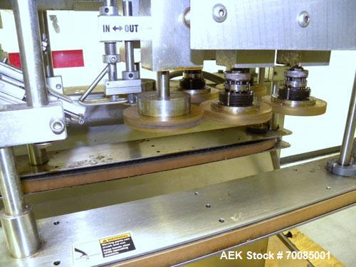 Used SureKap Fully Automatic Straight Line Six Spindle Quill Capper, Model SK6000-SP. Capacities 100 bottles per minute depending on size and conveyor speed. Cap Size Range: diameter 8mm to 110mm (Ma...