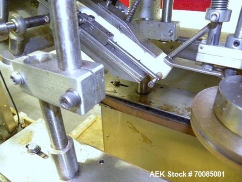 Used SureKap Fully Automatic Straight Line Six Spindle Quill Capper, Model SK6000-SP. Capacities 100 bottles per minute depending on size and conveyor speed. Cap Size Range: diameter 8mm to 110mm (Ma...