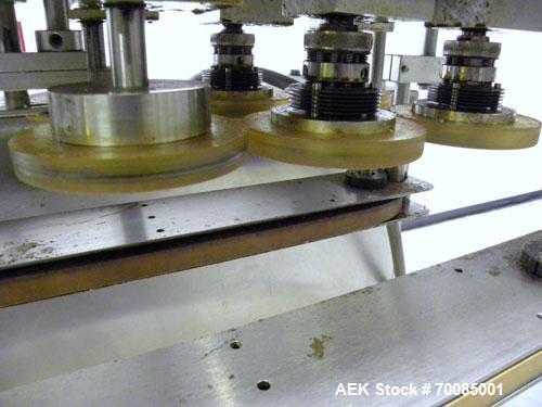 Used SureKap Fully Automatic Straight Line Six Spindle Quill Capper, Model SK6000-SP. Capacities 100 bottles per minute depending on size and conveyor speed. Cap Size Range: diameter 8mm to 110mm (Ma...
