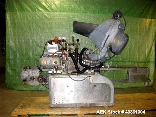 Used White Cap Vacuum Steam Flow Capper, Model VG2200LJG. Includes a cap hopper, and a 4 1/2" wide x 132" long conveyor. Machine was last running a 58mm cap.
