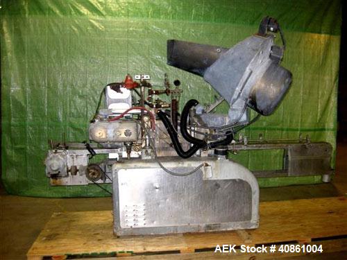 Used White Cap Vacuum Steam Flow Capper, Model VG2200LJG. Includes a cap hopper, and a 4 1/2" wide x 132" long conveyor. Machine was last running a 58mm cap.