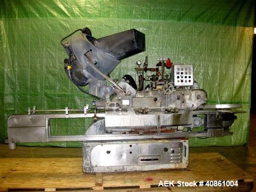 Used White Cap Vacuum Steam Flow Capper, Model VG2200LJG. Includes a cap hopper, and a 4 1/2" wide x 132" long conveyor. Machine was last running a 58mm cap.