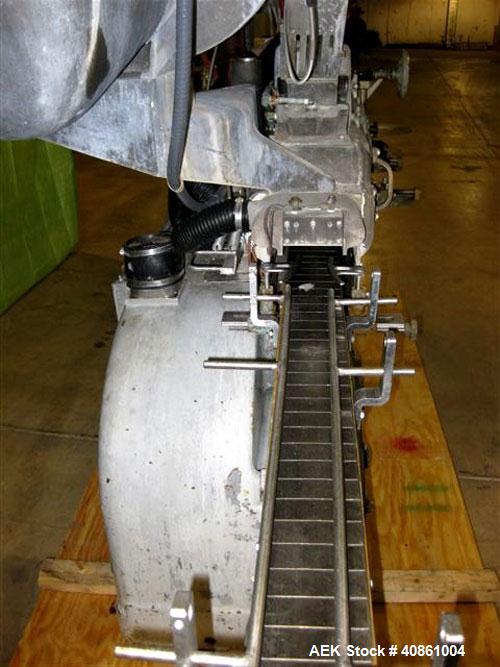 Used White Cap Vacuum Steam Flow Capper, Model VG2200LJG. Includes a cap hopper, and a 4 1/2" wide x 132" long conveyor. Machine was last running a 58mm cap.