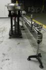 Used ELF Model CT400L Automatic Inline Quill Capper. Fully adjustable for a cap size range of 8mm - 110mm wide and a container size range of 1