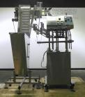Used Inline Filling Systems Automatic Belt Capper. Machine is rated at up to 200 caps per minute depending on cap size and container configuration. Capper main unit can handle a cap size range up to ...