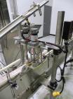 Used Inline Filling Systems inline belt capper with automatic cleated belt cap elevator. Capable of speeds up to 200 CPM (depending on cap size and container configuration). Has a container size rang...