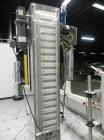 Used Inline Filling Systems inline belt capper with automatic cleated belt cap elevator. Capable of speeds up to 200 CPM (depending on cap size and container configuration). Has a container size rang...