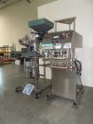 Used Inline Filling Systems Capper.  110V, 60 cycle.  Includes hopper and quality feeder Model 21CCW.  Manufactured 2002.