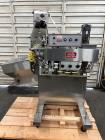 Used Kapsall Model A2 Inline Screw Capper. Capable of speeds up to 150 bottles per minute. Has single bottle grippers, three pair spindles  with adjustable cap chute and integrated cap elevator. Cap ...
