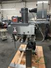Used Kapsall Model A2 Inline Screw Capper. Capable of speeds up to 150 bottles per minute. Has single bottle grippers, three pair spindles  with adjustable cap chute and integrated cap elevator. Cap ...