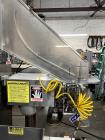 Used Kapsall Model A2 Inline Screw Capper. Capable of speeds up to 150 bottles per minute. Has single bottle grippers, three pair spindles  with adjustable cap chute and integrated cap elevator. Cap ...