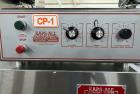 Used Kapsall Model A2 Inline Screw Capper. Capable of speeds up to 150 bottles per minute. Has single bottle grippers, three pair spindles  with adjustable cap chute and integrated cap elevator. Cap ...