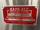 Used Kapsall Model A2 Inline Screw Capper. Capable of speeds up to 150 bottles per minute. Has single bottle grippers, three pair spindles  with adjustable cap chute and integrated cap elevator. Cap ...