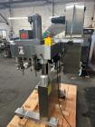 Used Kapsall Model A 2Inline Screw Capper. Capable of speeds up to 150 bottles per minute. Has single bottle grippers, three pair spindles  with adjustable cap chute and integrated cap elevator. Cap ...