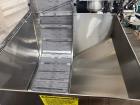Used Kapsall Model A 2Inline Screw Capper. Capable of speeds up to 150 bottles per minute. Has single bottle grippers, three pair spindles  with adjustable cap chute and integrated cap elevator. Cap ...