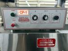 Used Kapsall Model A 2Inline Screw Capper. Capable of speeds up to 150 bottles per minute. Has single bottle grippers, three pair spindles  with adjustable cap chute and integrated cap elevator. Cap ...