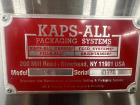 Used Kapsall Model A 2Inline Screw Capper. Capable of speeds up to 150 bottles per minute. Has single bottle grippers, three pair spindles  with adjustable cap chute and integrated cap elevator. Cap ...