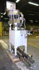 Used Kapsall Model A Inline Screw Capper. Capable of speeds up to 200 bottles per minute. Has dual bottle grippers, three pair spindles and 24