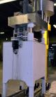 Used Kapsall Model A Inline Screw Capper. Capable of speeds up to 200 bottles per minute. Has dual bottle grippers, three pair spindles and 24