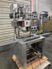 Used- Kapsall Model A Inline Screw Capper. Capable of speeds up to 200 bottles per minute. Has single bottle grippers, three...