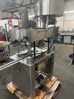 Used- Kapsall Model A Inline Screw Capper. Capable of speeds up to 200 bottles per minute. Has single bottle grippers, three...