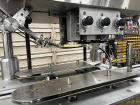 Used- Kapsall Model A Inline Screw Capper. Capable of speeds up to 200 bottles per minute. Has single bottle grippers, three...