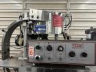 Used- Kapsall Model A Inline Screw Capper. Capable of speeds up to 200 bottles per minute. Has single bottle grippers, three...