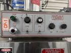 Used- Kapsall Model A Inline Screw Capper. Capable of speeds up to 200 bottles per minute. Has single bottle grippers, three...