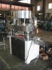 Used KapsAll, Model C-8, Automatic (8) Spindle Capper. Single belt container gripper. Manufacture stated cap size range 8mm-120mm (with proper change parts).