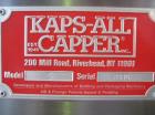 Used KapsAll, Model C-8, Automatic (8) Spindle Capper. Single belt container gripper. Manufacture stated cap size range 8mm-120mm (with proper change parts).