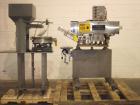 Used SureKap 3 Spindle Quill Capper, Model SK6000-SP18M. Adjustable chute will handle caps from 13 to 110mm without change parts. Has dual gripper belts, C frame construction will mount up to any con...