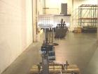 Used SureKap 3 Spindle Quill Capper, Model SK6000-SP18M. Adjustable chute will handle caps from 13 to 110mm without change parts. Has dual gripper belts, C frame construction will mount up to any con...