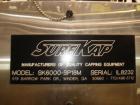 Used SureKap 3 Spindle Quill Capper, Model SK6000-SP18M. Adjustable chute will handle caps from 13 to 110mm without change parts. Has dual gripper belts, C frame construction will mount up to any con...