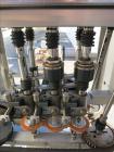 Used Pack West Model Auto 120 capper capable of speeds from 80 - 150 caps per minute. Cap size range: 10mm - 120mm with changeparts.  In-Line Cappe, 6 Quill capper, dual gripper belt, gripper speed c...