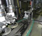 Used Resina Model NRU51 High Speed Automatic Inline Quill Capper. Machine is capable of speeds up to 300 bpm. Cap size range: 10mm to 89mm with changeparts. Equipped with dual belt gripper, H26 exten...