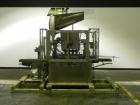 Used Resina Model U40-663 Automatic Inline Capper. Machine is capable of speeds up to 300 caps per minute. Adjustable from 10mm-70mm caps. Has top mounted cap sorter with hopper. Machine has 2HR pin ...
