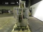 Used Resina Model U40-663 Automatic Inline Capper. Machine is capable of speeds up to 300 caps per minute. Adjustable from 10mm-70mm caps. Has top mounted cap sorter with hopper. Machine has 2HR pin ...